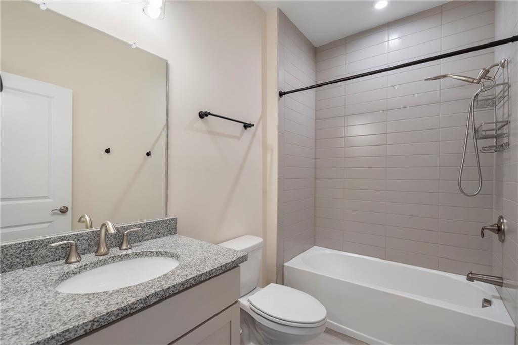 2059 Falls Park Way Decatur, GA 30033 - Photo 33 of 45 a bathroom with a granite countertop sink toilet and shower