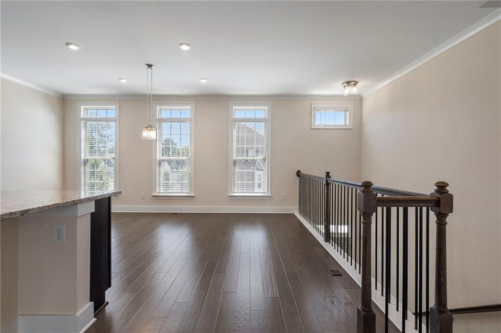 2059 Falls Park Way Decatur, GA 30033 - Photo 10 of 45 a view of an empty room with wooden floor and a window