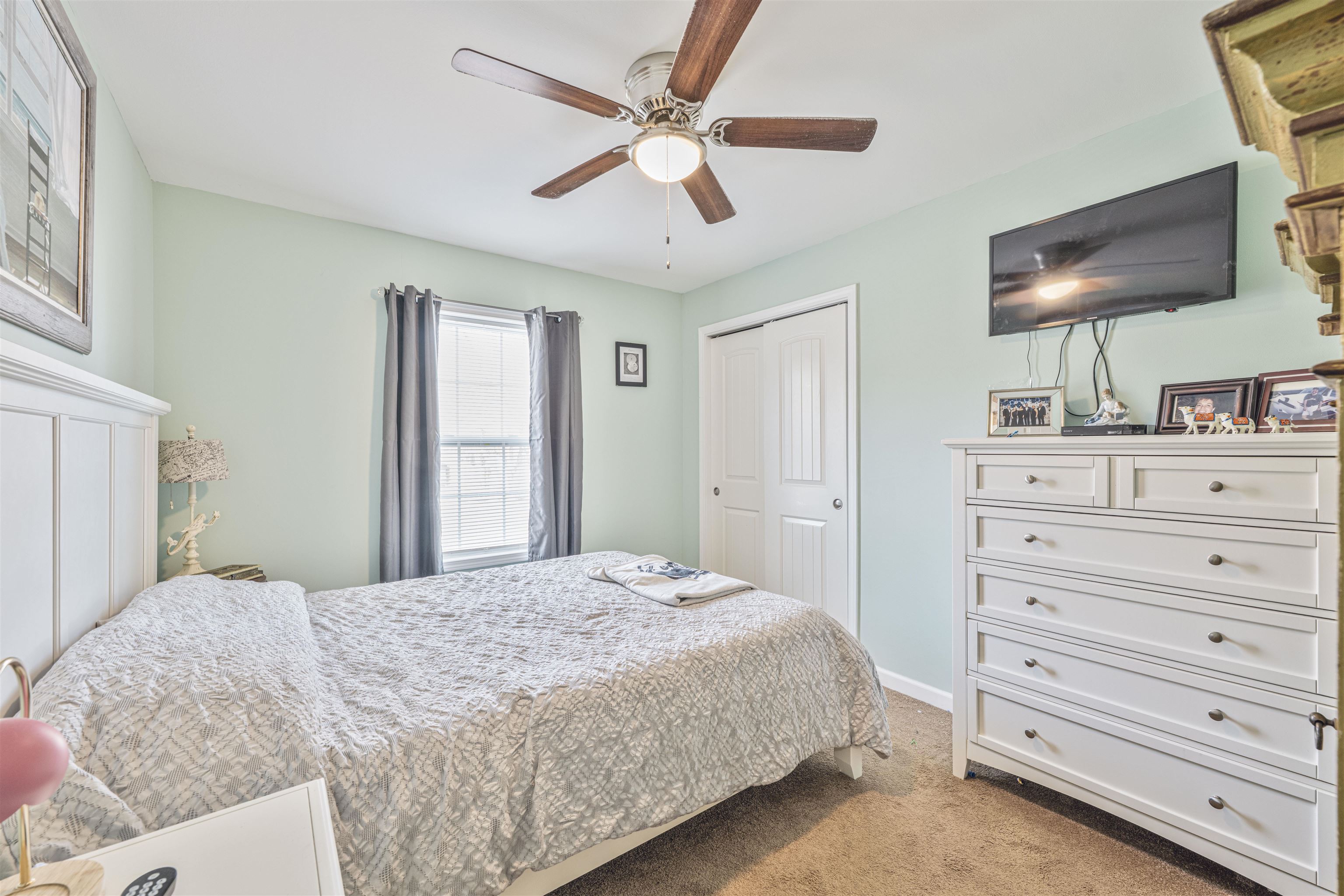 720 Town Bank Road North Cape May, NJ 08204 - Photo 22 of 49 a bedroom with a bed and a flat screen tv