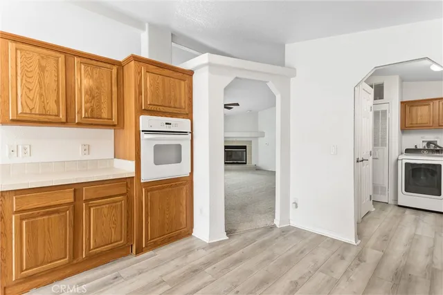 a kitchen with stainless steel appliances granite countertop a refrigerator and cabinets