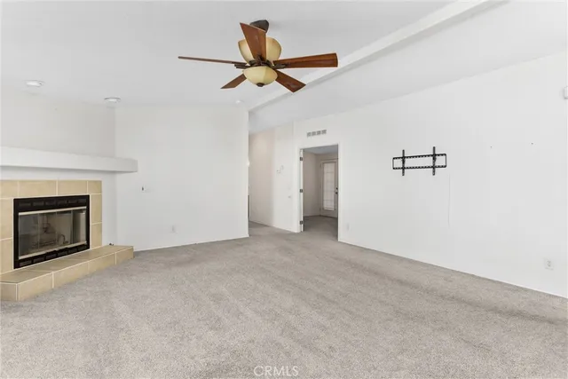 a view of a livingroom with a ceiling fan and ceiling fan