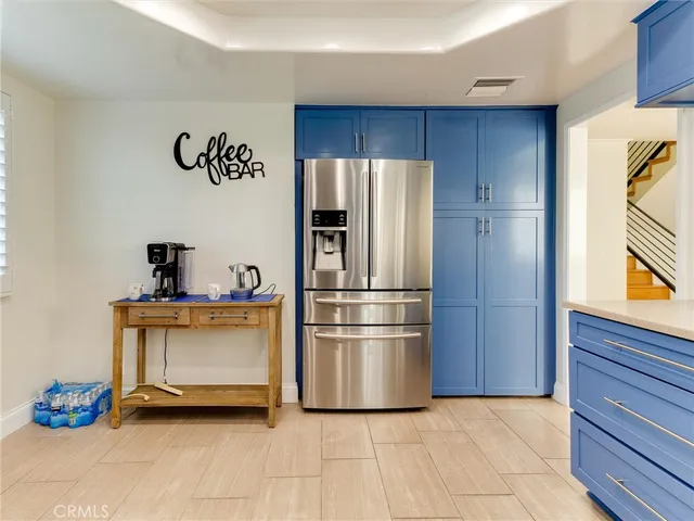 a kitchen with stainless steel appliances a refrigerator and a stove