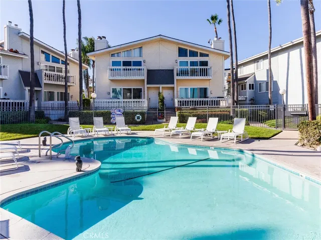 a view of pool with brick walls