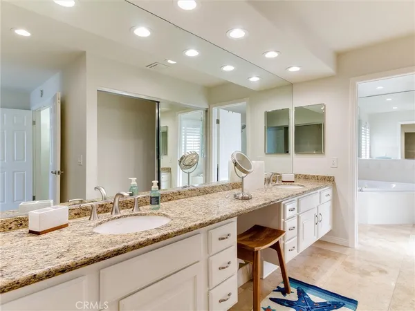 a view of a granite countertop sink and a wooden floor