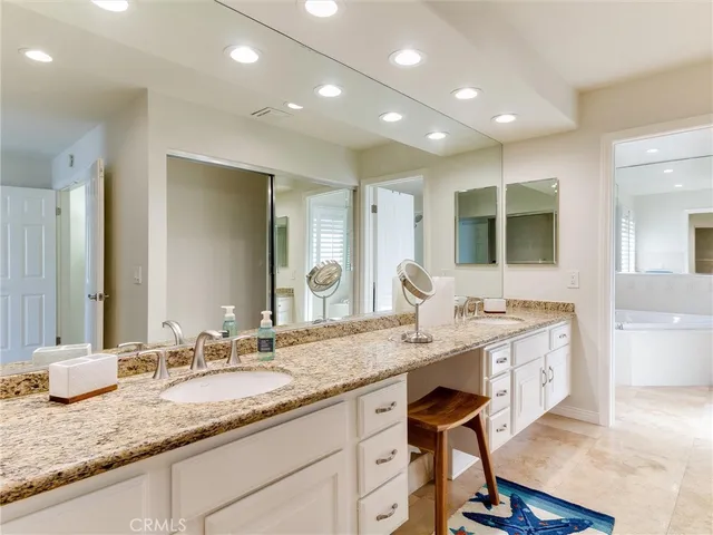 a view of a granite countertop sink and a wooden floor