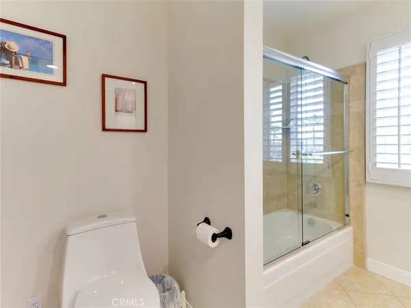 a bathroom with a shower and toilet