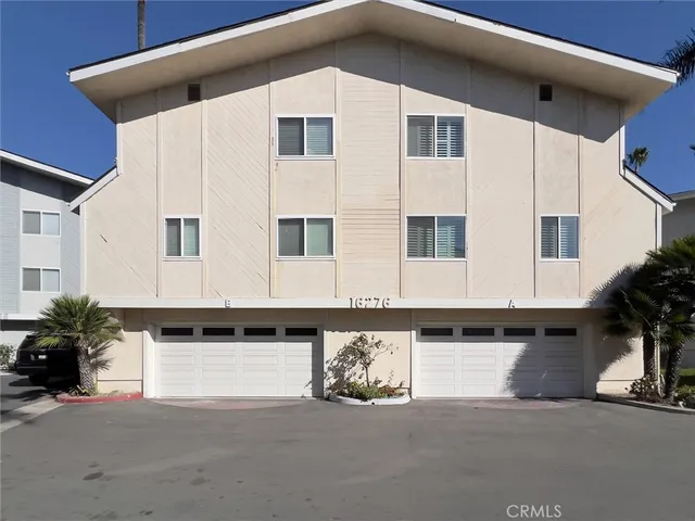 a front view of a house with garage