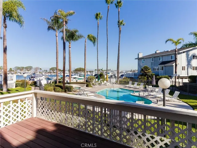 a view of a balcony with chairs