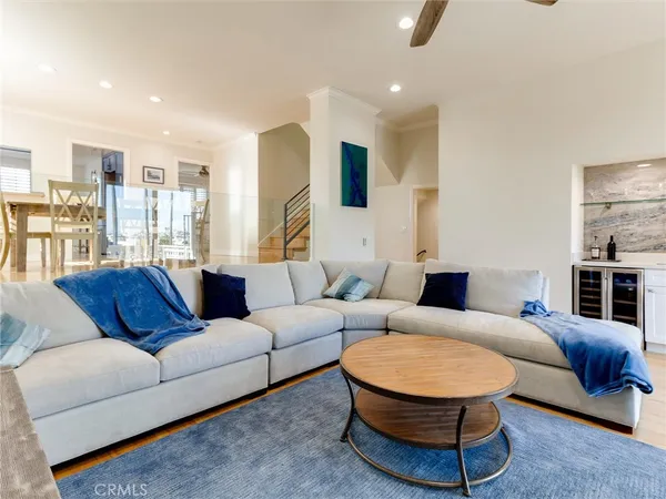 a living room with furniture ceiling fan and a rug