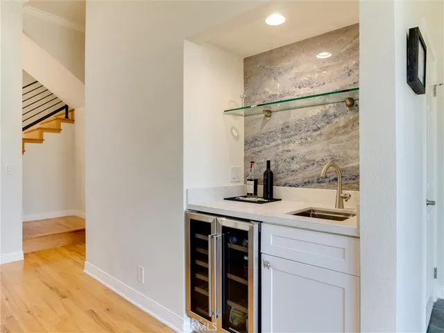 a kitchen with a refrigerator and a sink
