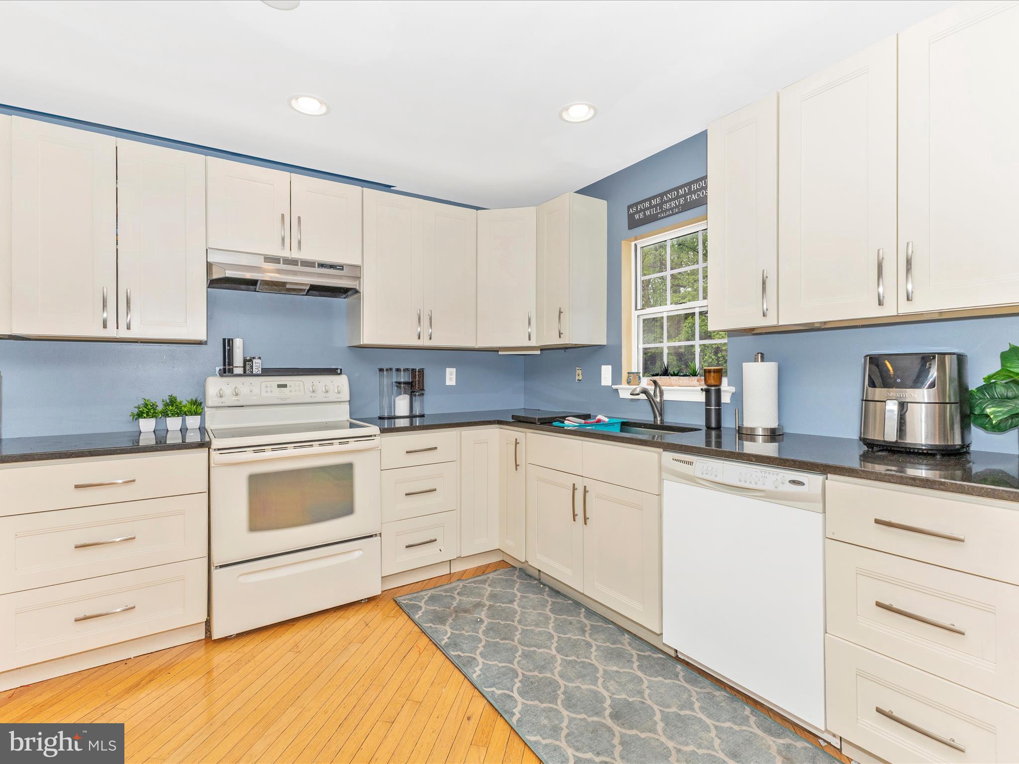 2544 Ambling Circle, Unit 31 Crofton, MD 21114 - Photo 12 of 52 a kitchen with granite countertop white cabinets and white appliances