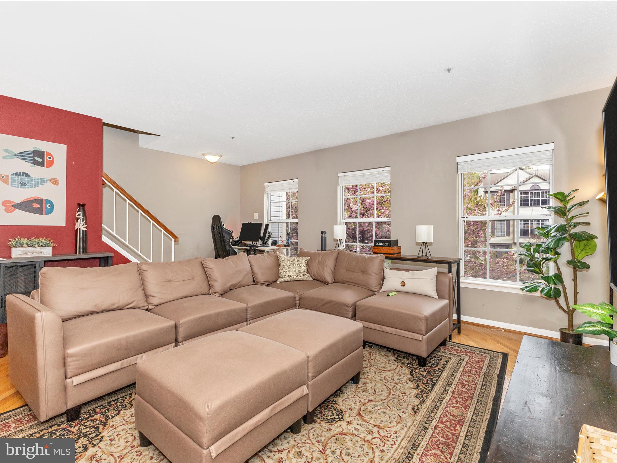 2544 Ambling Circle, Unit 31 Crofton, MD 21114 - Photo 16 of 52 a living room with furniture and a book shelf
