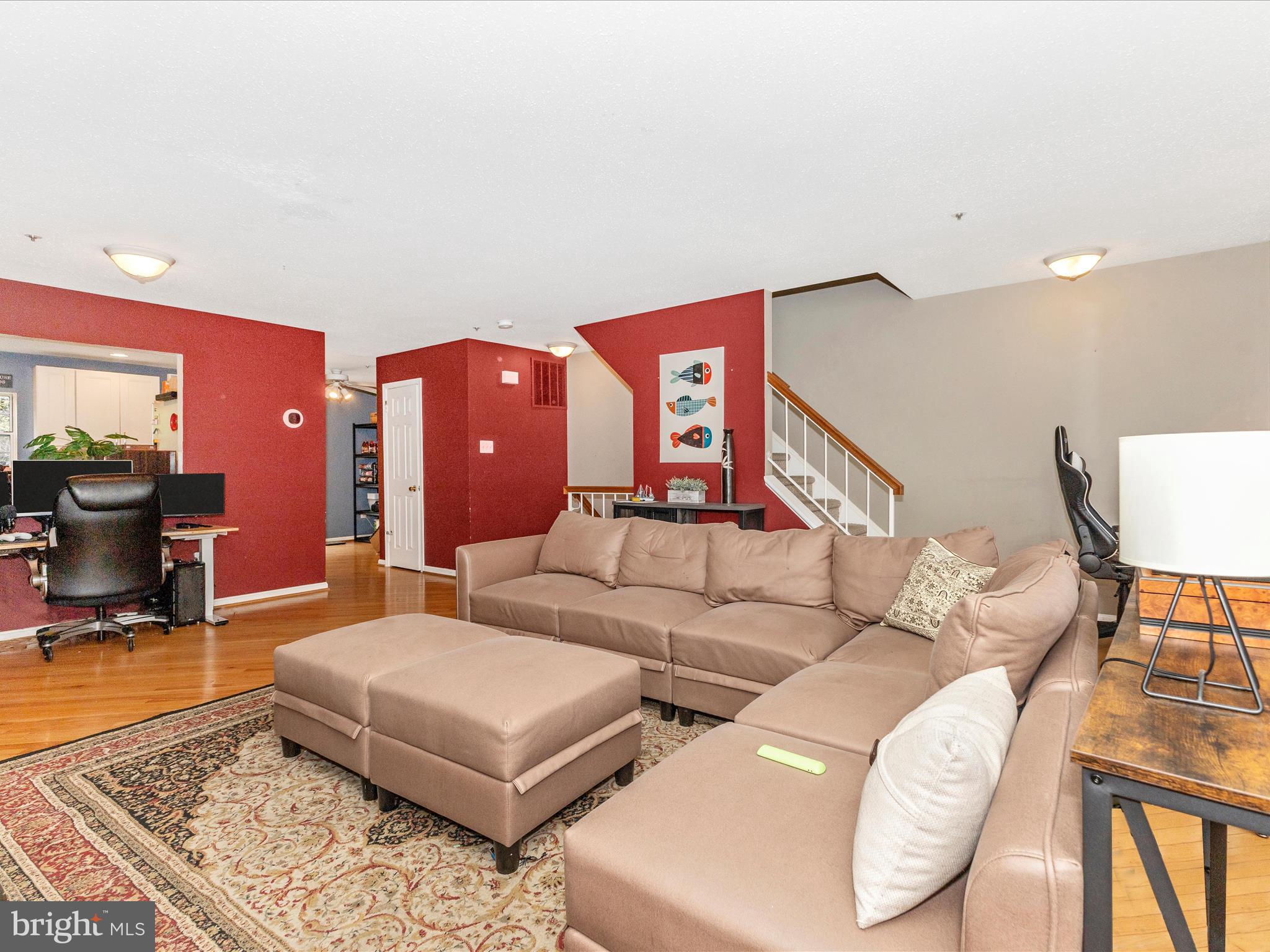 2544 Ambling Circle, Unit 31 Crofton, MD 21114 - Photo 18 of 52 a living room with furniture and wooden floor