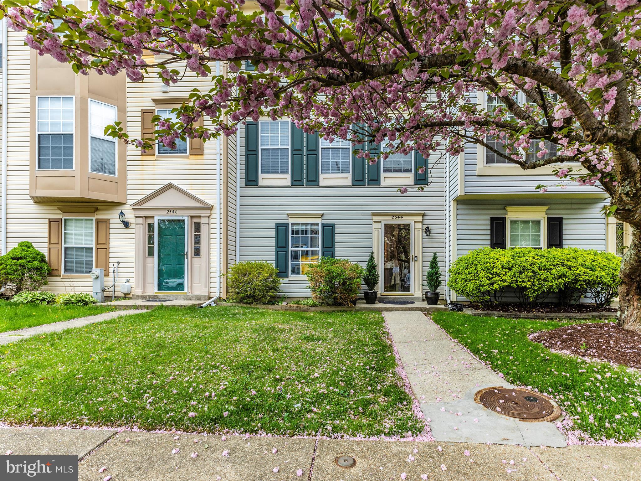 2544 Ambling Circle, Unit 31 Crofton, MD 21114 - Photo 2 of 52 front view of a brick house with a yard