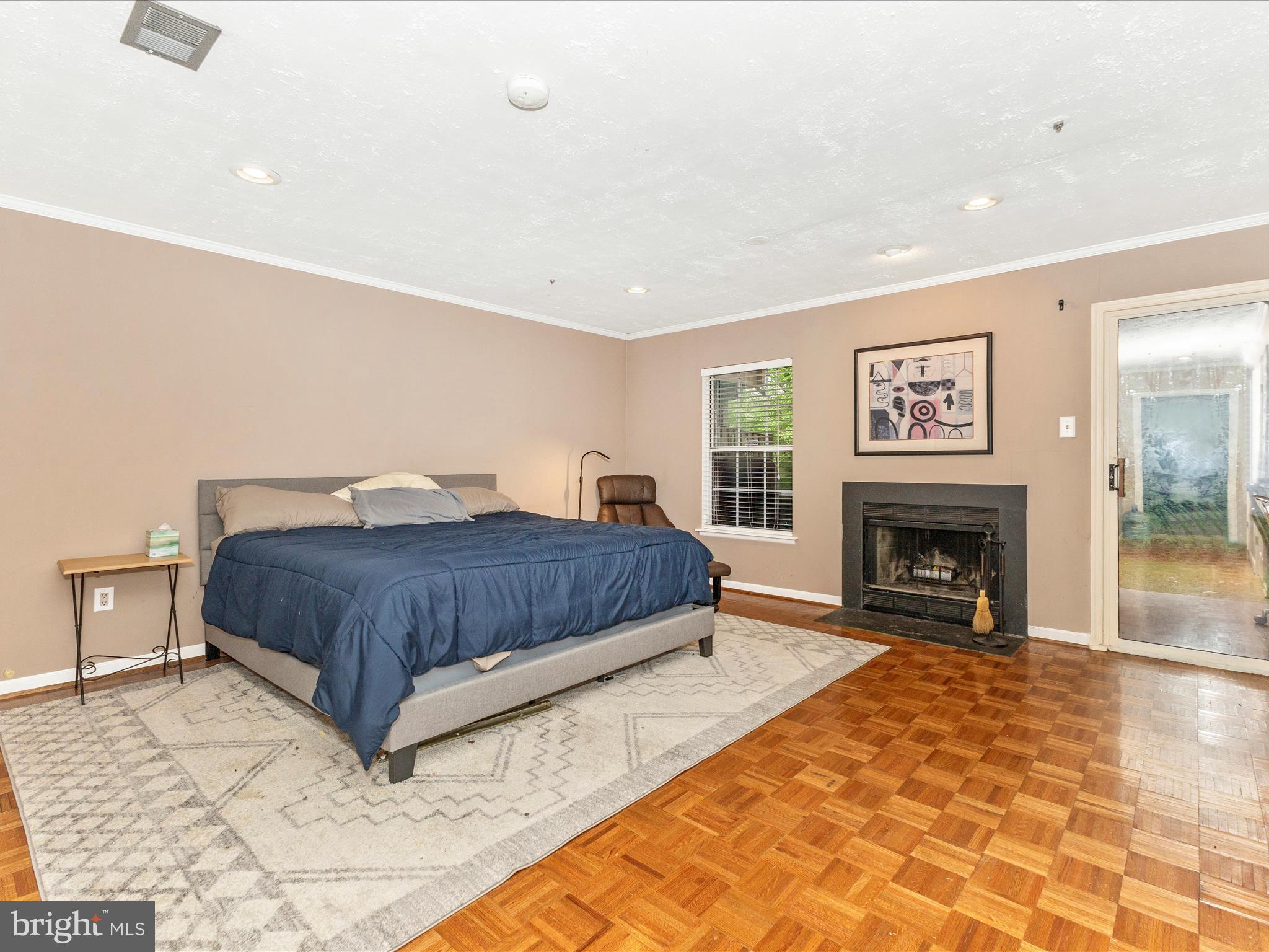 2544 Ambling Circle, Unit 31 Crofton, MD 21114 - Photo 21 of 52 a spacious bedroom with a large bed and a fireplace