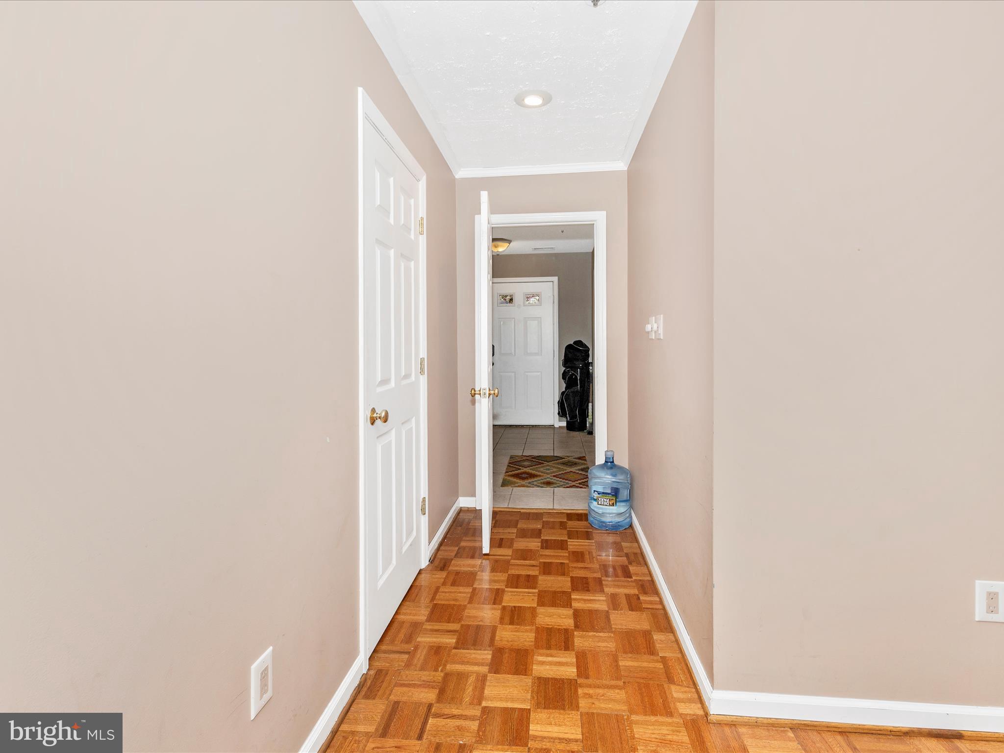 2544 Ambling Circle, Unit 31 Crofton, MD 21114 - Photo 25 of 52 a hallway with a white door and wooden floor