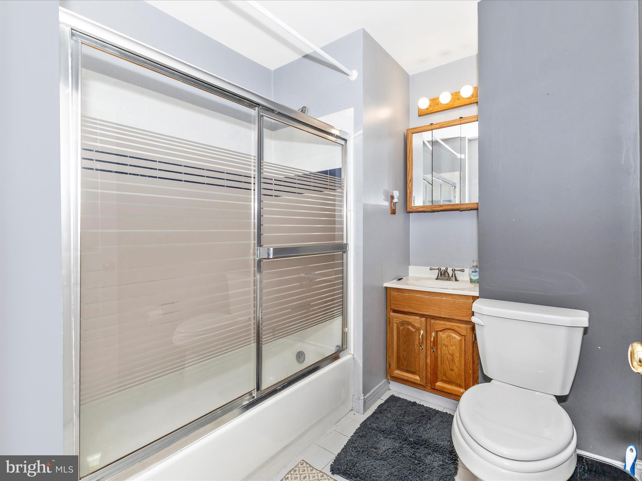 2544 Ambling Circle, Unit 31 Crofton, MD 21114 - Photo 26 of 52 a bathroom with a toilet a sink and shower