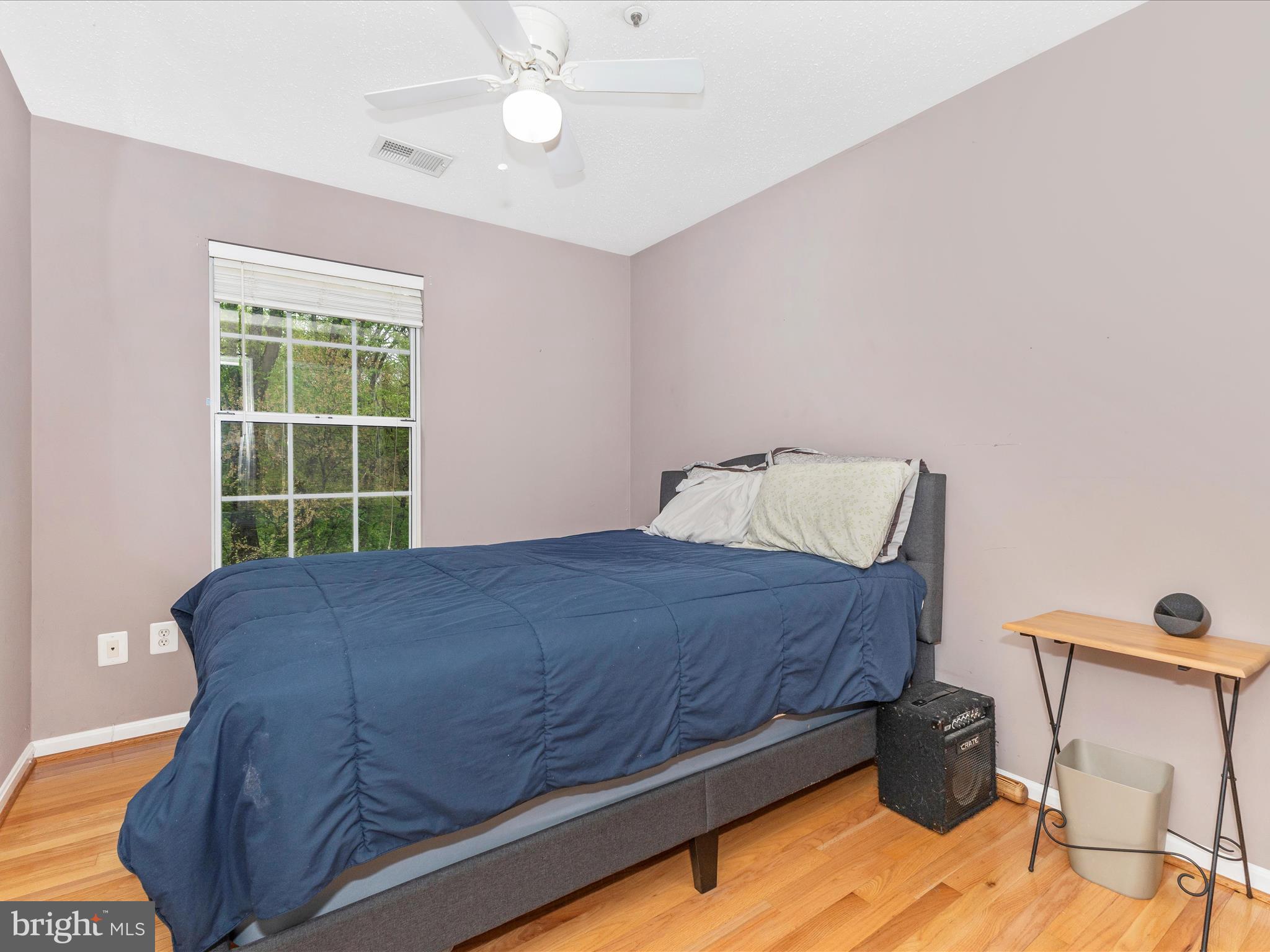 2544 Ambling Circle, Unit 31 Crofton, MD 21114 - Photo 32 of 52 a bed sitting in a bedroom next to a window