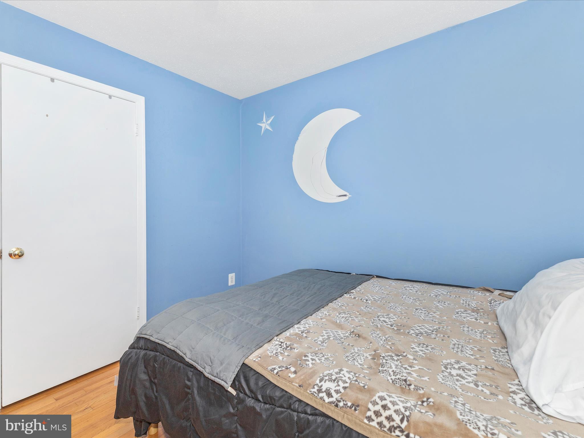 2544 Ambling Circle, Unit 31 Crofton, MD 21114 - Photo 35 of 52 a bedroom with a bed and a painting on the wall