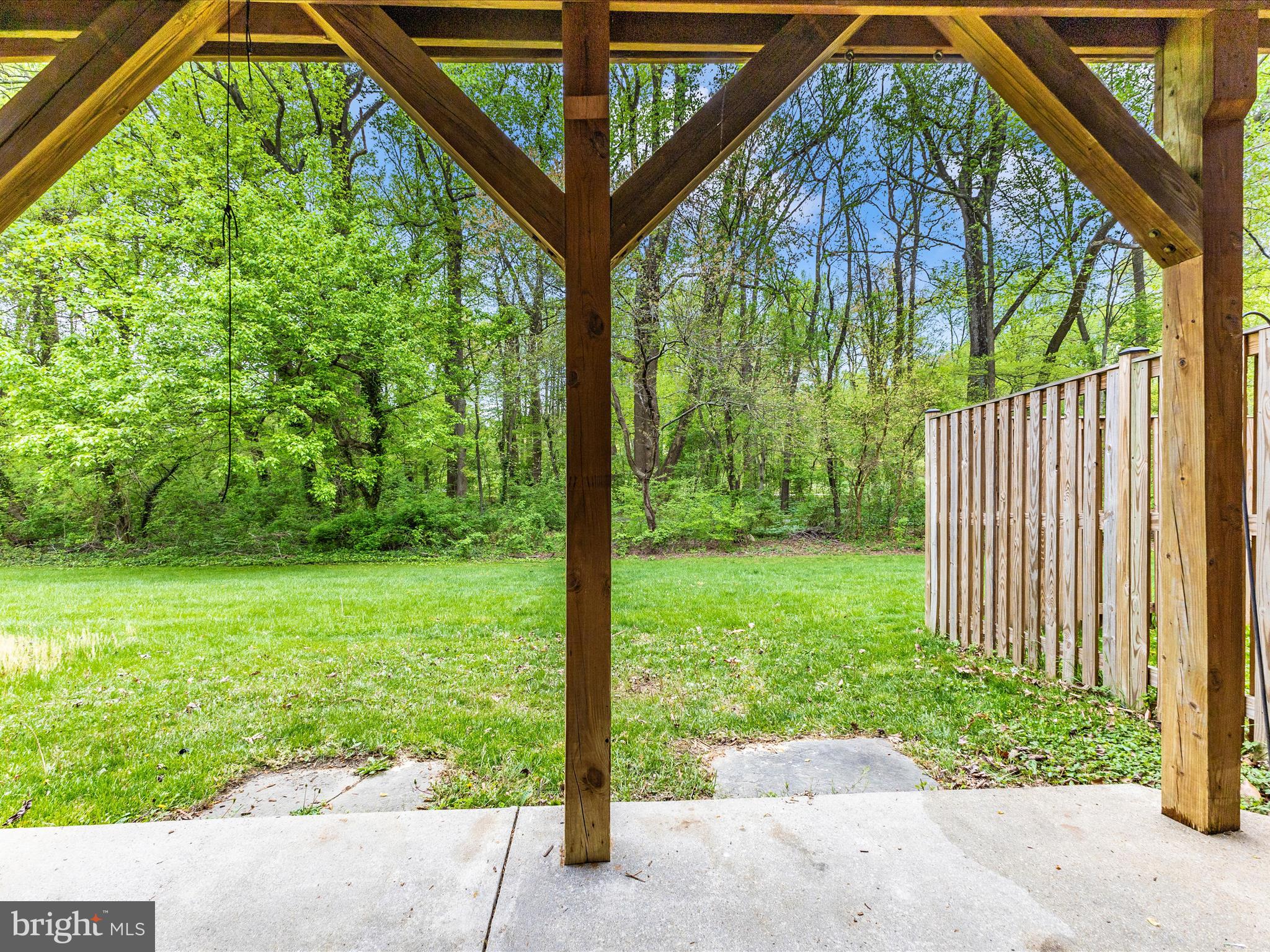 2544 Ambling Circle, Unit 31 Crofton, MD 21114 - Photo 48 of 52 a porch with a trees in the back yard