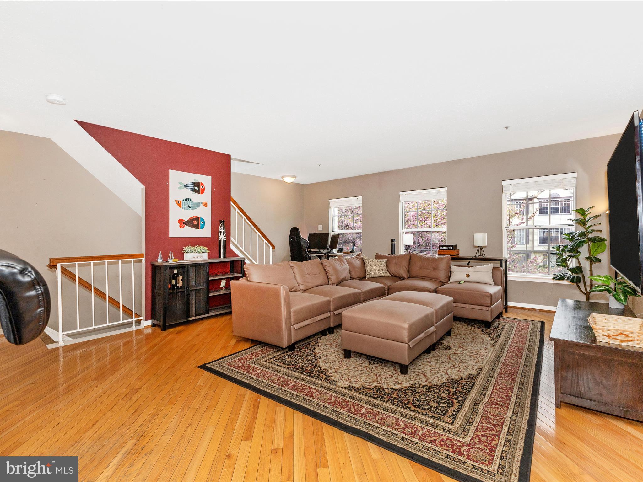 2544 Ambling Circle, Unit 31 Crofton, MD 21114 - Photo 5 of 52 a living room with furniture and a dining table with wooden floor
