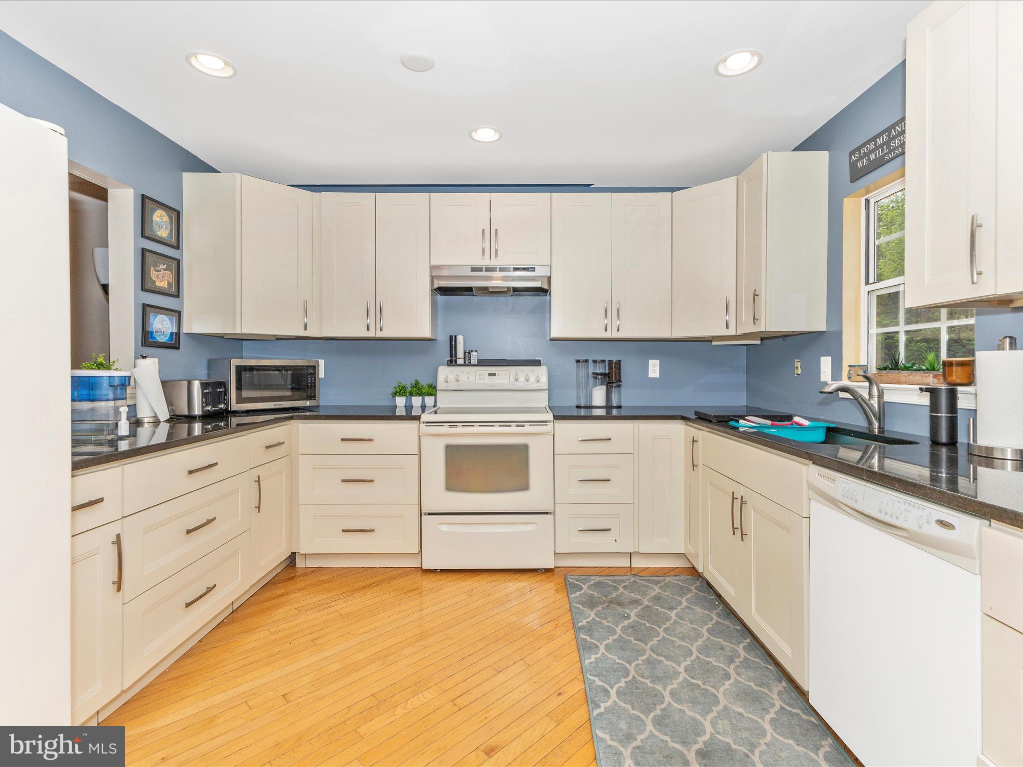 2544 Ambling Circle, Unit 31 Crofton, MD 21114 - Photo 7 of 52 a kitchen with granite countertop white cabinets and white appliances