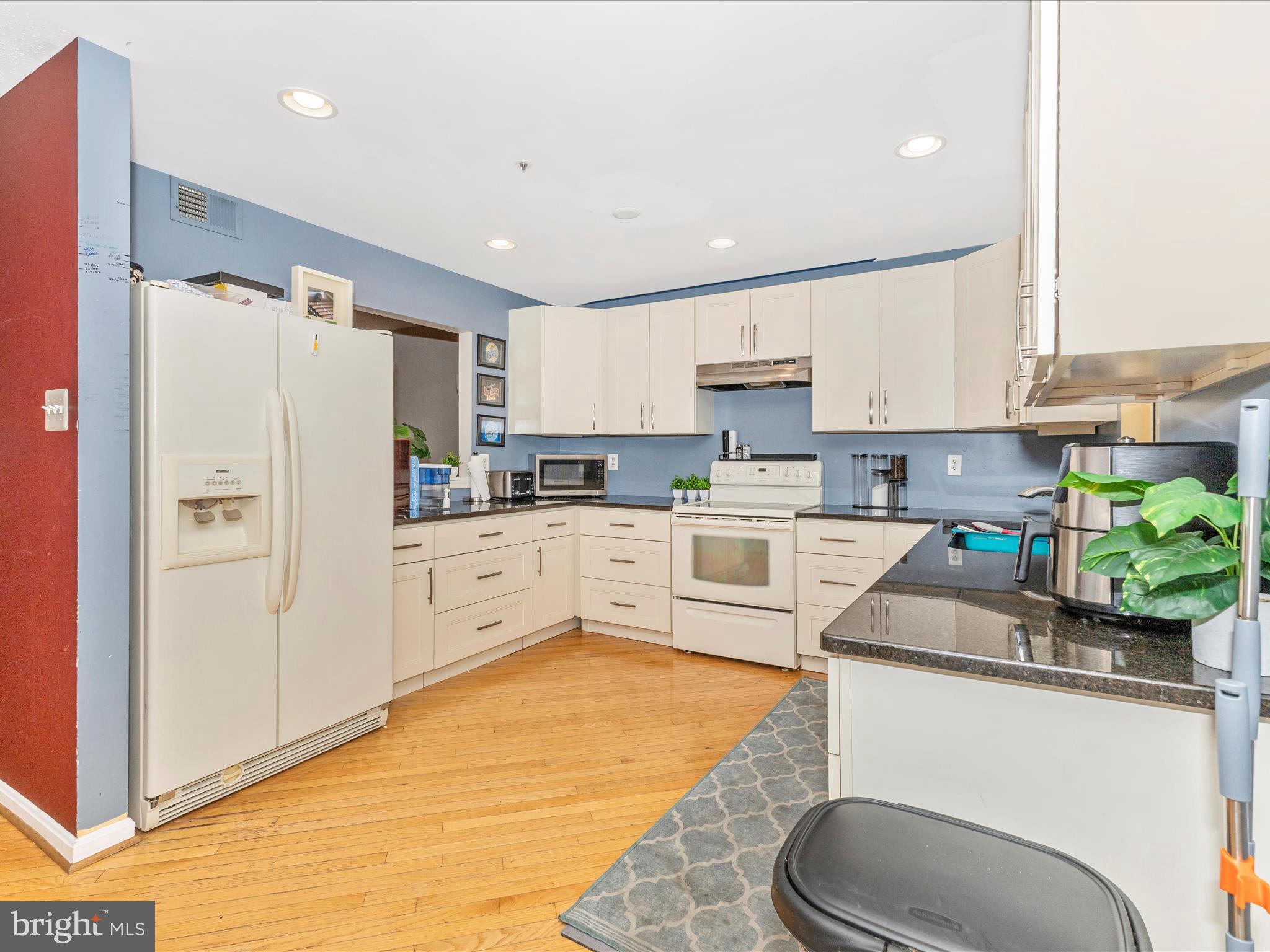 2544 Ambling Circle, Unit 31 Crofton, MD 21114 - Photo 8 of 52 a kitchen with stainless steel appliances granite countertop a refrigerator sink and white cabinets