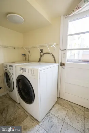a utility room with dryer and washer