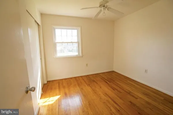 an empty room with a windows