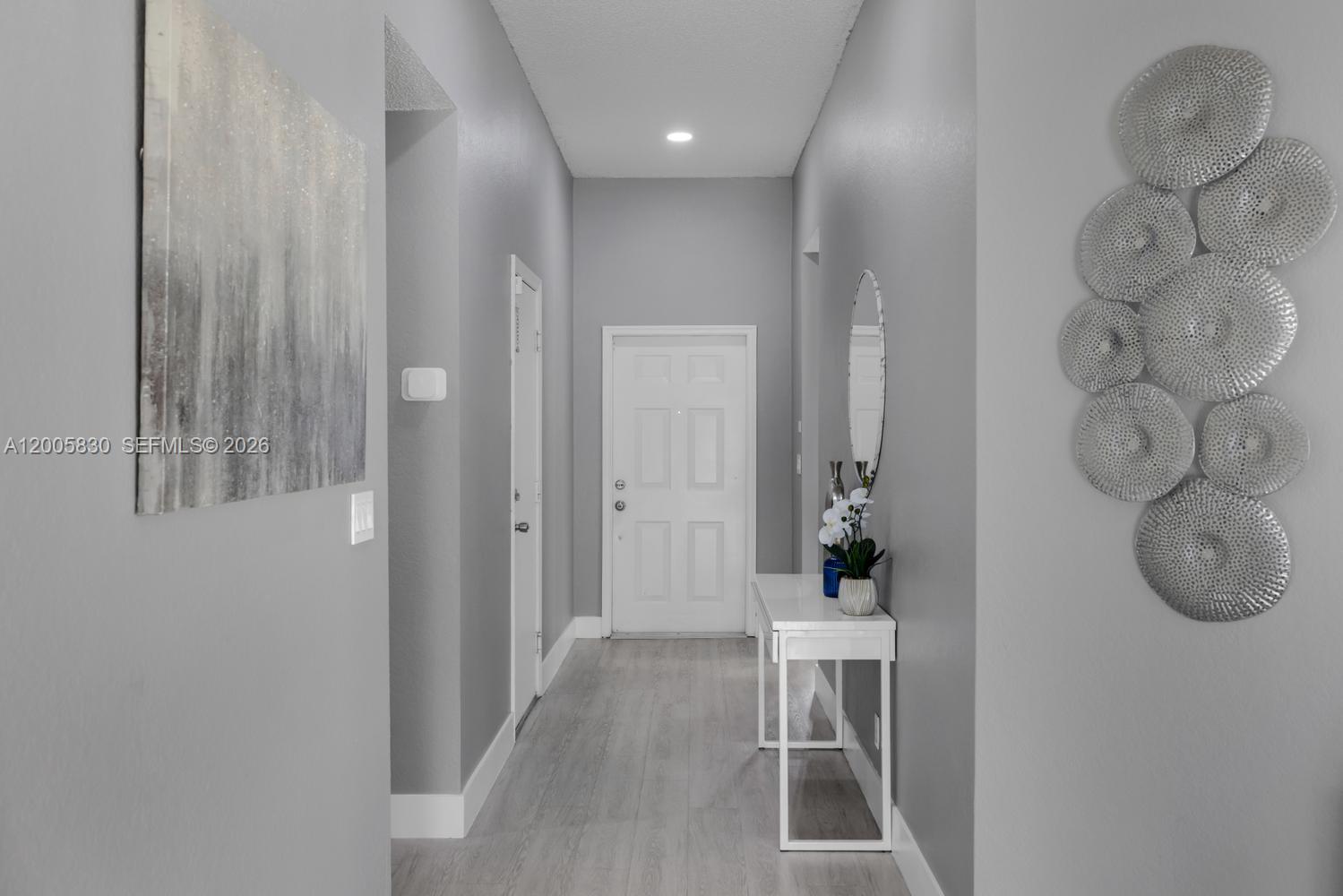 5861 South Sable Circle Margate, FL 33063 - Photo 14 of 56 a view of a hallway with wooden floor and entryway