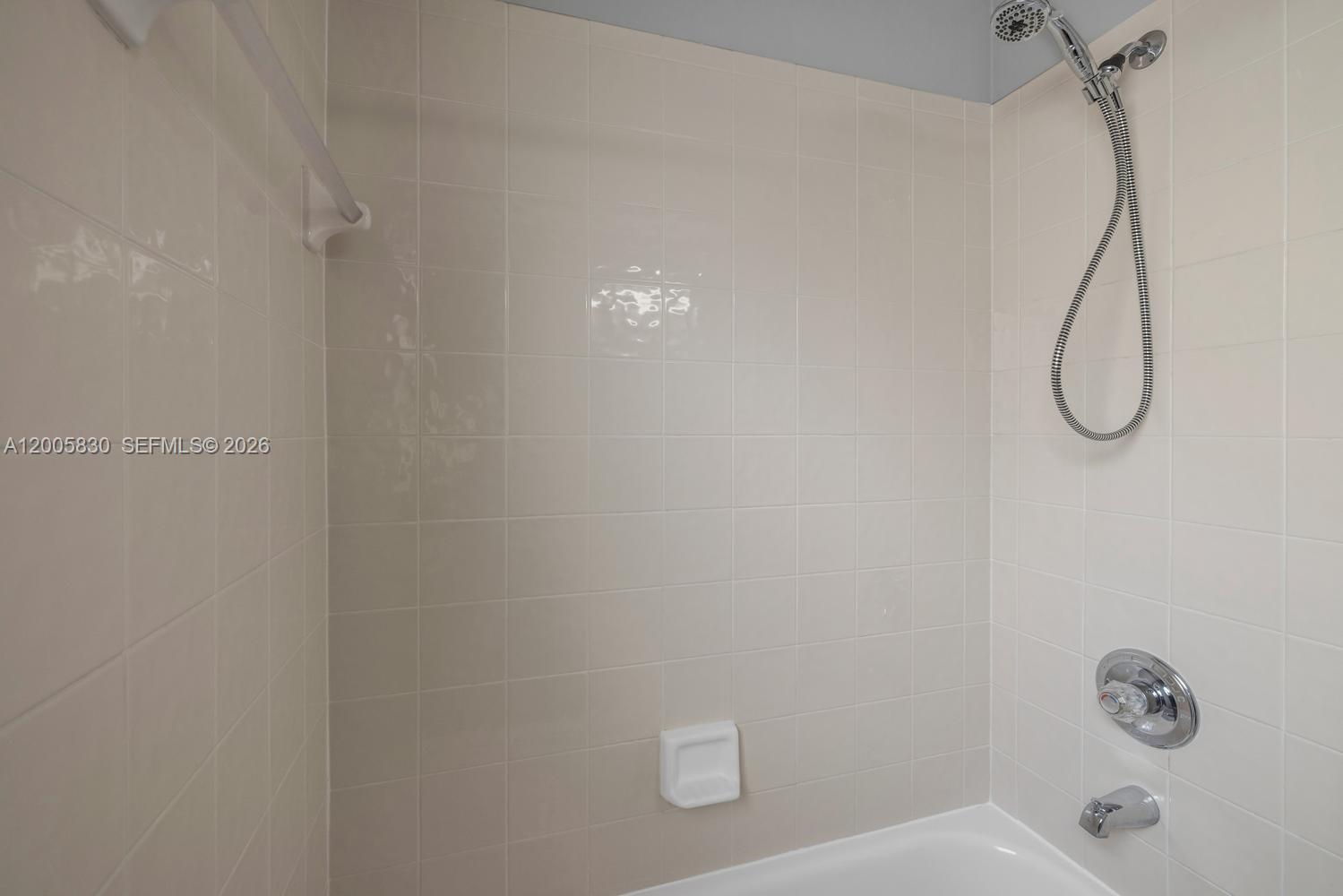5861 South Sable Circle Margate, FL 33063 - Photo 24 of 56 a bathroom with a shower and a shower head