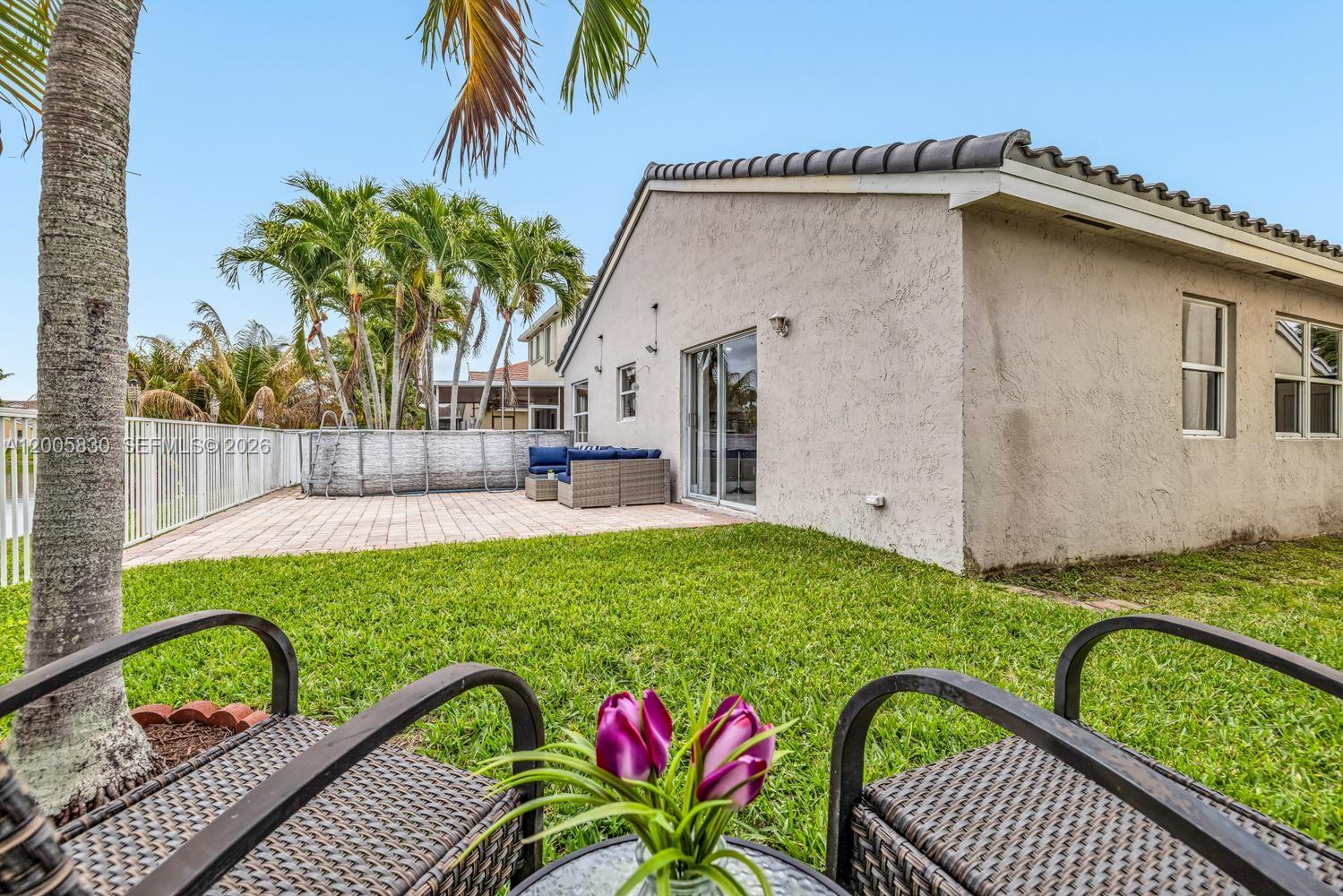 5861 South Sable Circle Margate, FL 33063 - Photo 27 of 56 a house view with a garden space