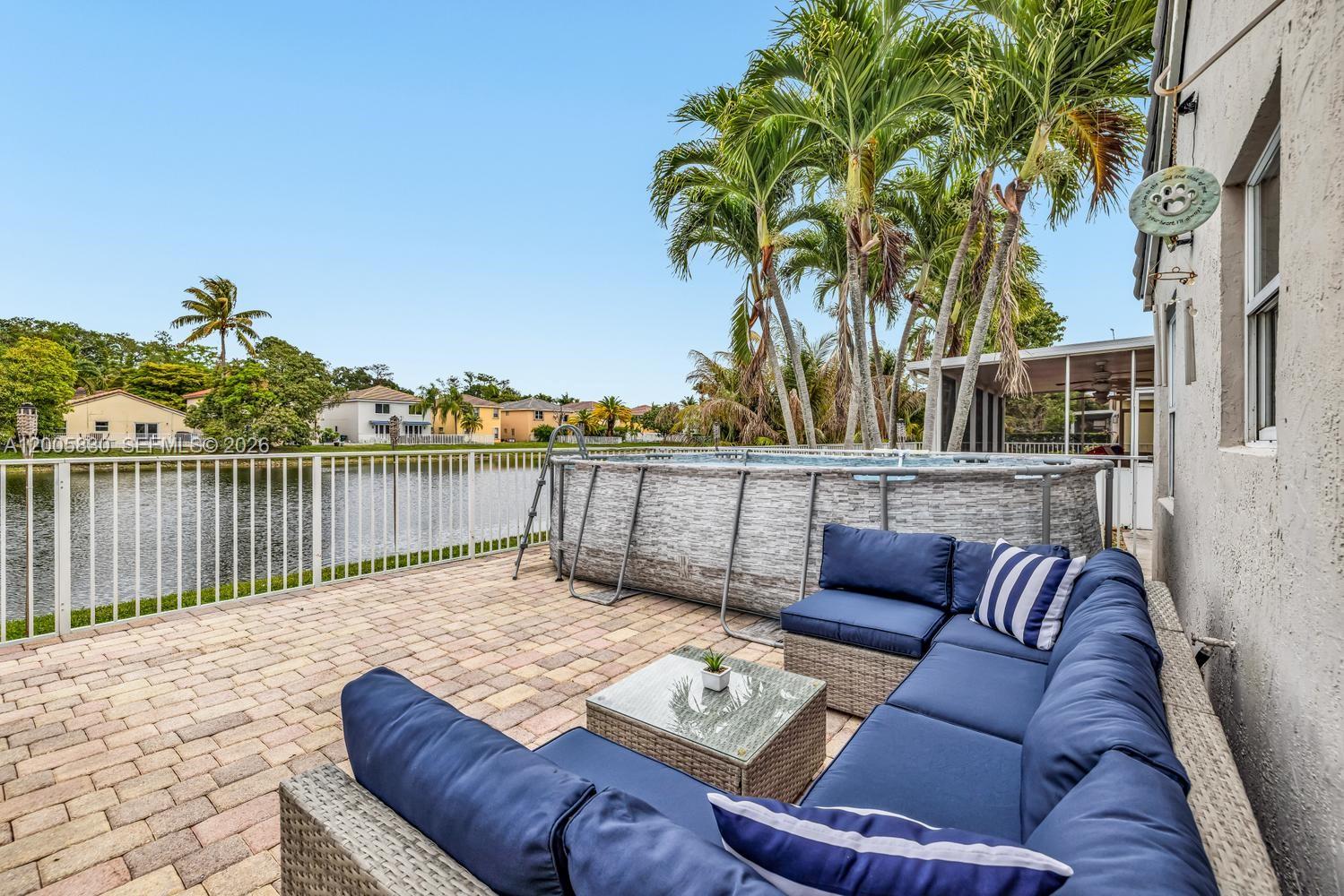 5861 South Sable Circle Margate, FL 33063 - Photo 29 of 56 a balcony with furniture and a potted plant