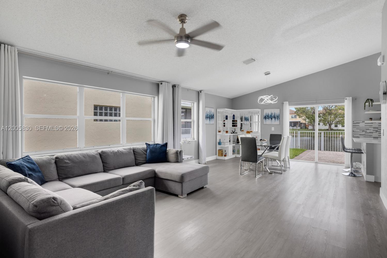 5861 South Sable Circle Margate, FL 33063 - Photo 3 of 56 a living room with furniture and a large window