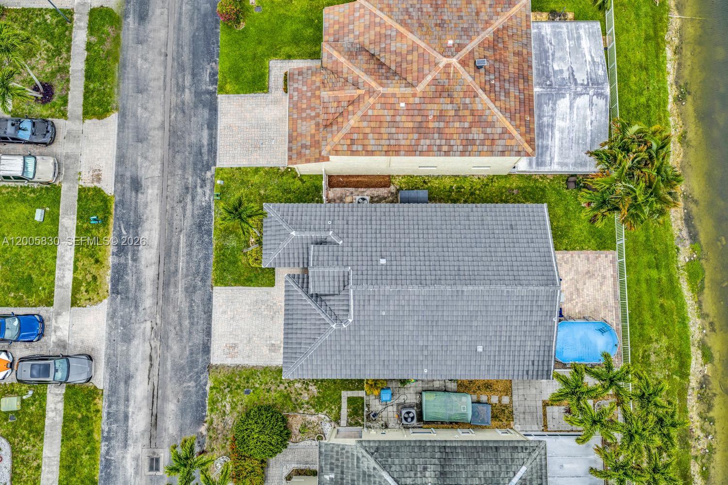 5861 South Sable Circle Margate, FL 33063 - Photo 36 of 56 front view of a house with a garden
