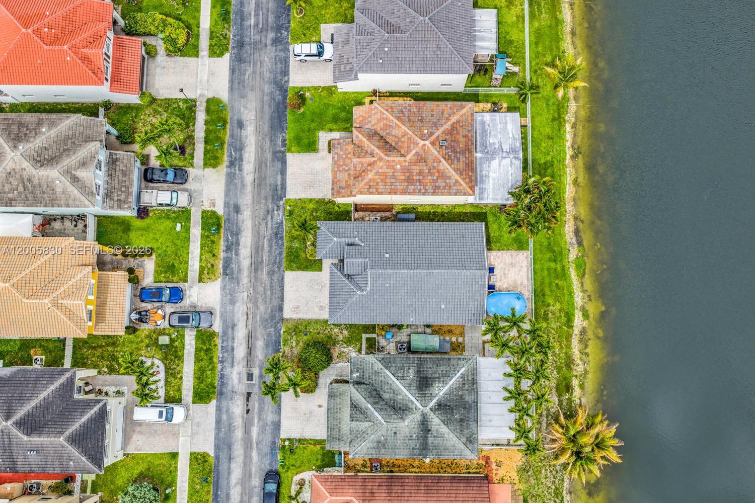 5861 South Sable Circle Margate, FL 33063 - Photo 37 of 56 an aerial view of a house with a yard and large trees