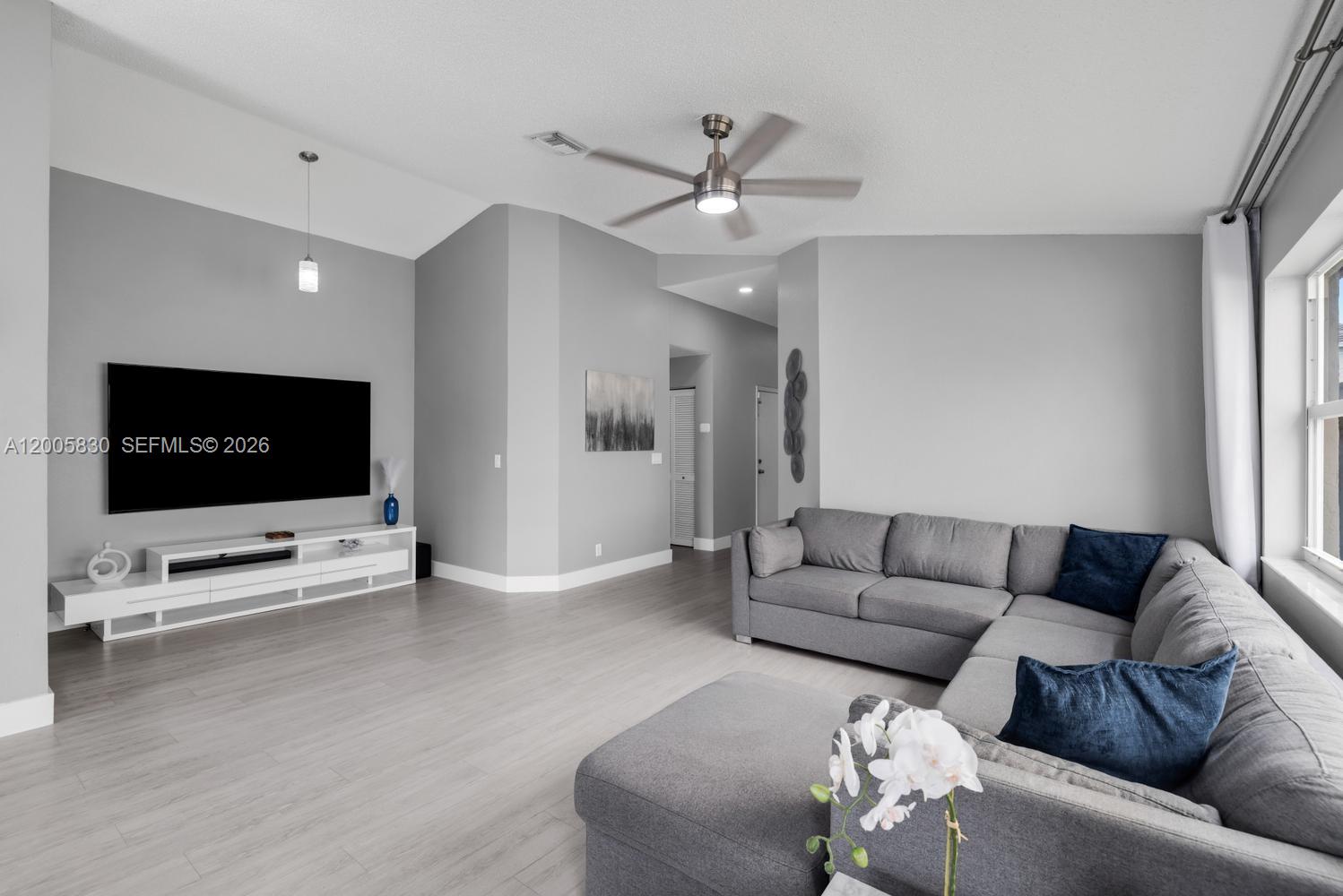 5861 South Sable Circle Margate, FL 33063 - Photo 4 of 56 a living room with furniture and a flat screen tv