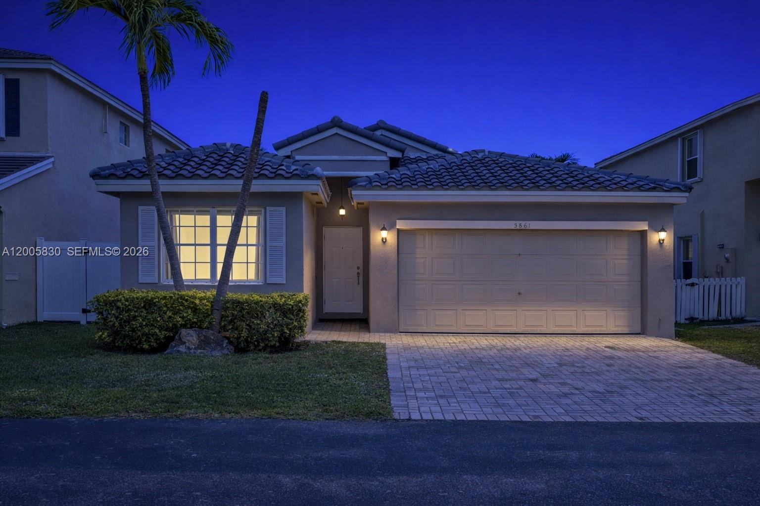 5861 South Sable Circle Margate, FL 33063 - Photo 56 of 56 a front view of a house with garden