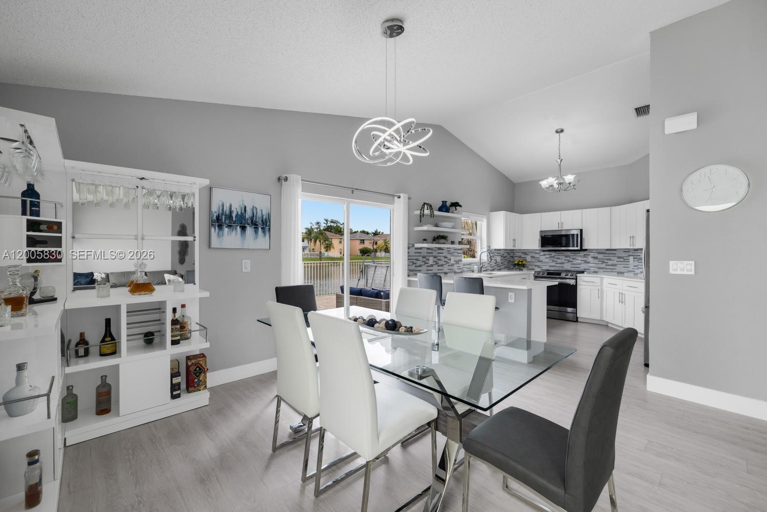 5861 South Sable Circle Margate, FL 33063 - Photo 7 of 56 a view of a dining room with furniture and a kitchen