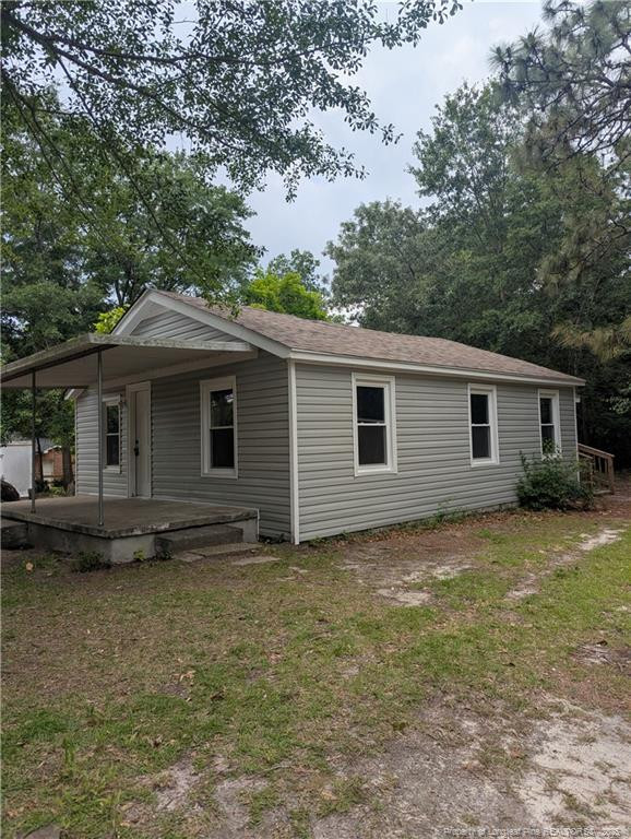 245 Maxie Loop Spring Lake, NC 28390 - Photo 2 of 10 a view of a house with a yard