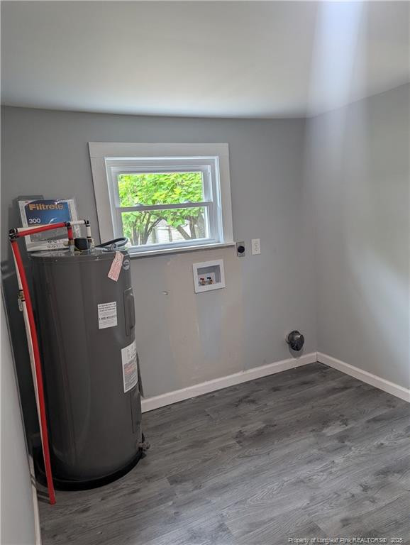 245 Maxie Loop Spring Lake, NC 28390 - Photo 8 of 10 an empty room with wooden floor and a window