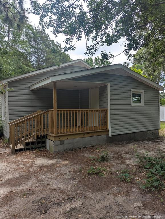 245 Maxie Loop Spring Lake, NC 28390 - Photo 9 of 10 a view of a house with a yard