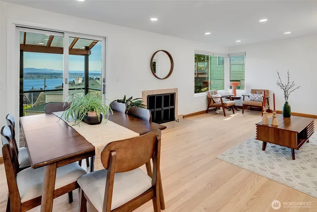 a living room with furniture a table and a large window
