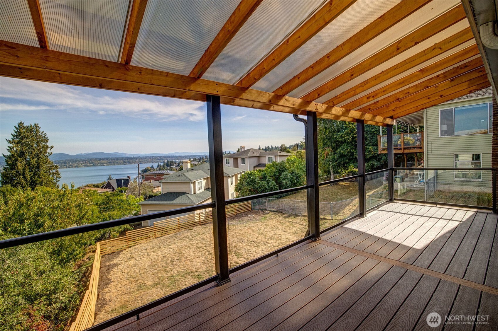 9804 63rd Avenue South Seattle, WA 98118 - Photo 14 of 40 a view of a balcony with wooden floor