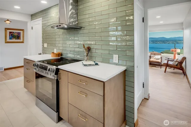 a kitchen with a sink stove and cabinets