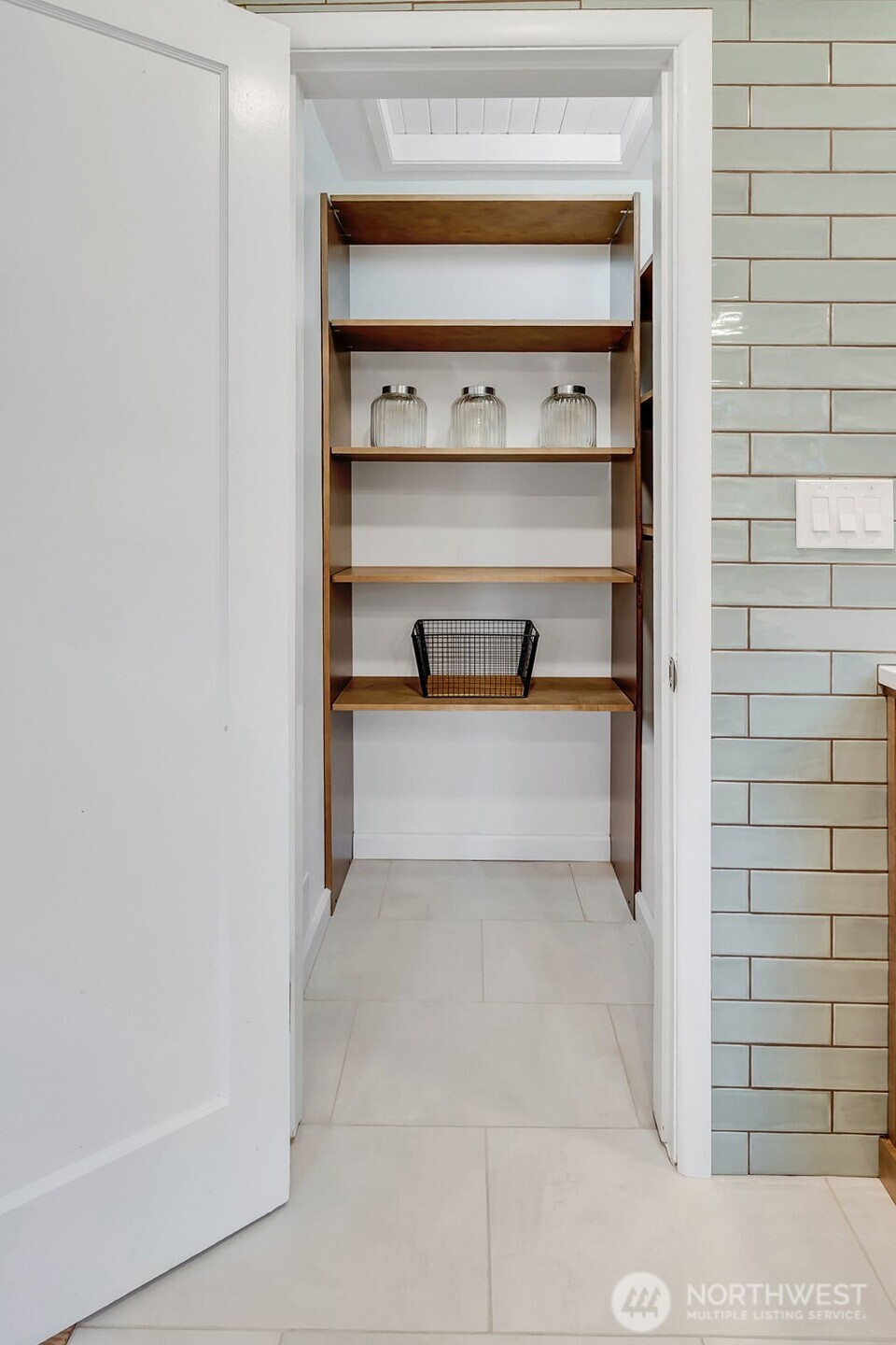 9804 63rd Avenue South Seattle, WA 98118 - Photo 20 of 40 a view of a room with rack on the wall
