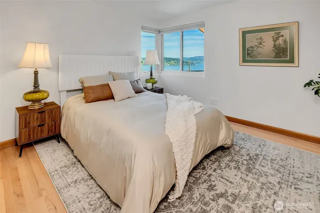 a bed room with a bed and a lamp