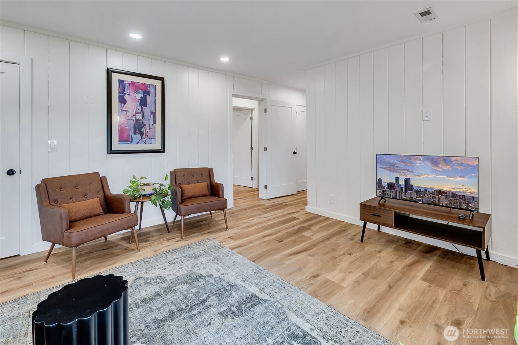 9804 63rd Avenue South Seattle, WA 98118 - Photo 29 of 40 a living room with furniture and a rug