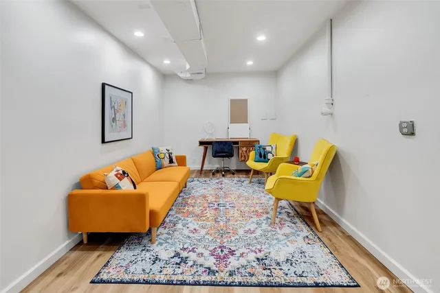 a living room with furniture and a rug