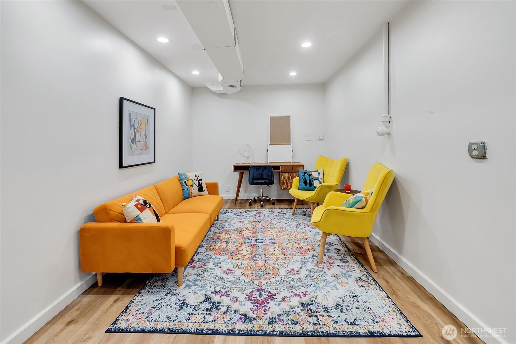 9804 63rd Avenue South Seattle, WA 98118 - Photo 36 of 40 a living room with furniture and a rug
